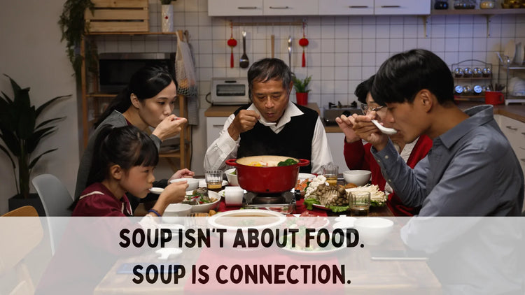 asian family getting together on table enjoying a meal an d sipping soup