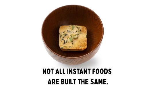 wooden bowl with a freeze dried miso soup cube in the middle 