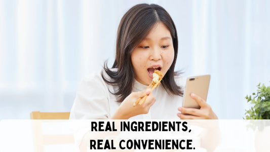 girl busy on phone eating a quick meal with words describing below "real ingredients, real convenience".
